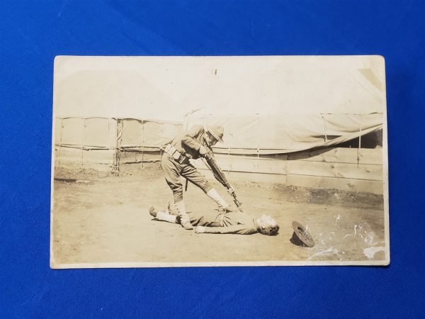 photo-of-a-soldier-having-fun-with-a bayonet-and-another-soldier-acting-that-he-has-been-pierced-world-war-one