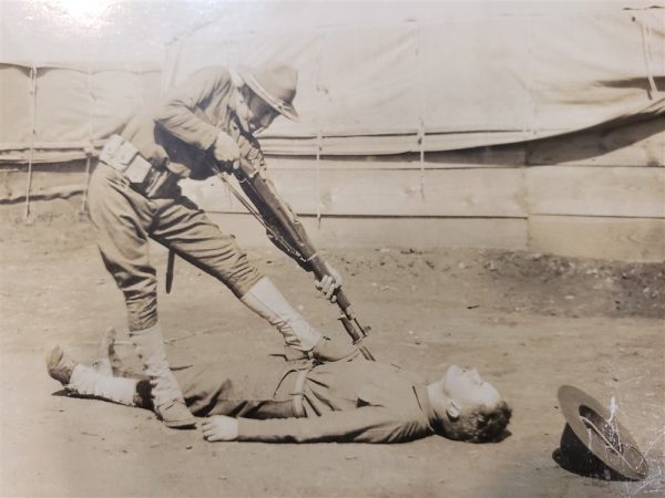 photo-of-a-soldier-having-fun-with-a bayonet-and-another-soldier-acting-that-he-has-been-pierced-world-war-one