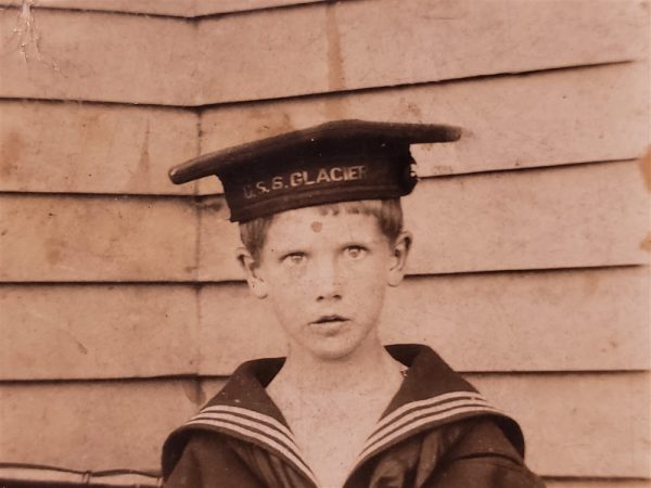 photo-of-small-child-one-with-uss-glacier-hat-on-full-uniform