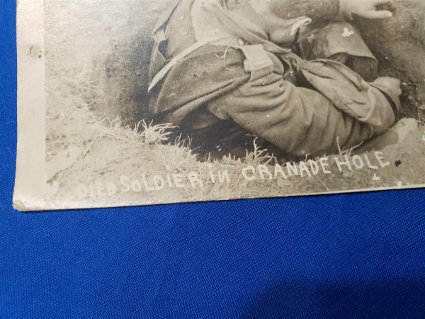 photo-of0dead-french-soldier-in-foxhole-with-head-wound-in-detail-clips-of-ammo-surrond-him-world-war-one