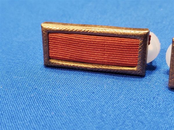 RIBBON SET CITATION RED BLUE THEATER MADE SET. Excellent pair of Citations that have the copper (not gold) and with the original plastic clips on the back. This look nice but with nice examination are NOT the quality or