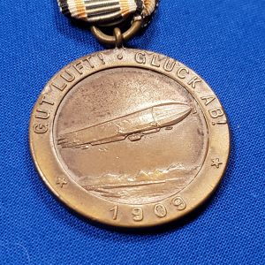 german-graf-zeppelin-medal-1909-with-original-ribbon-and-scene-of-airship-on-back