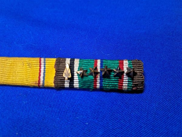 world-war-two-ribbon-bar-3-places-with-good-conduct-american-defense-and-european-theater-with-arrow-and-5-battle-stars