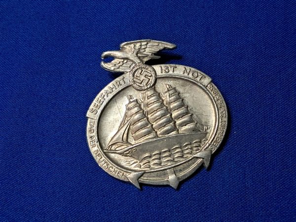 world-war-two-1935-dated-sea-faring-tinnie-german-raising-navy-personel-before-war-pin-ship-on-front-aluminum