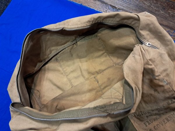 world-war-two-pilots-equipment-bag-for-carrying-into-aircraft-officer-clothing-items-dirty-but-very-solid