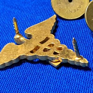 world-war-two-medical-officers-insignia-with-a-applied-in-brown-enemel-matched-set-unmarked