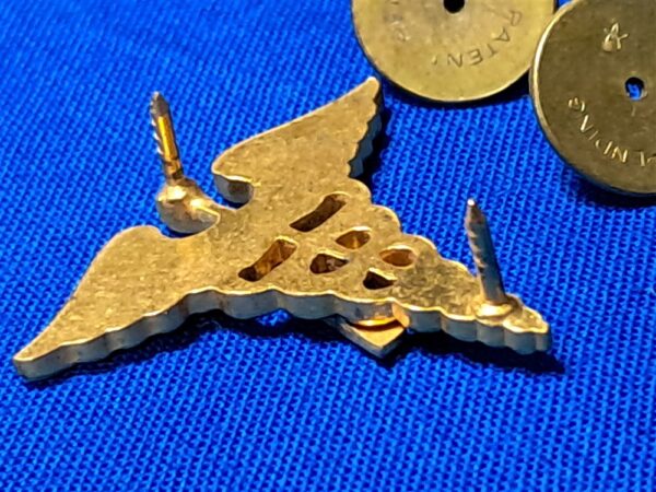 world-war-two-medical-officers-insignia-with-a-applied-in-brown-enemel-matched-set-unmarked