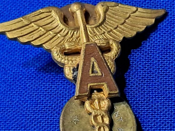 world-war-two-medical-officers-insignia-with-a-applied-in-brown-enemel-matched-set-unmarked