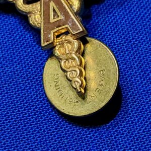 world-war-two-medical-officers-insignia-with-a-applied-in-brown-enemel-matched-set-unmarked