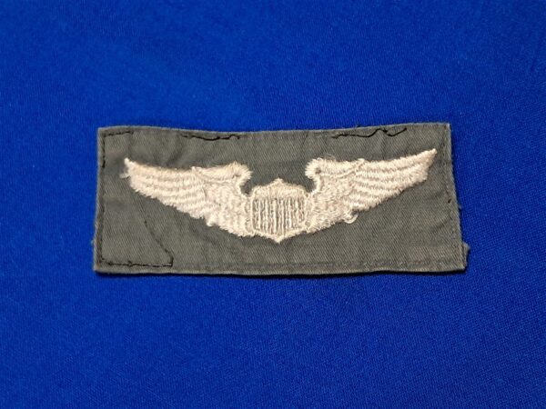 wings-flight-suit vietnam-war-early-flight-jacket-pair-of-embroidered-wings-on-nylon-rayon-material-full-size-white-uniform-removed
