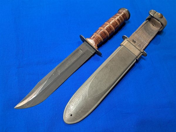 mk2-nav-knife original-world-war-two-mark-2-naval-fighting-knife-by-camillus-unissued-condition-leather-handle-with-sheath-fiber-construction